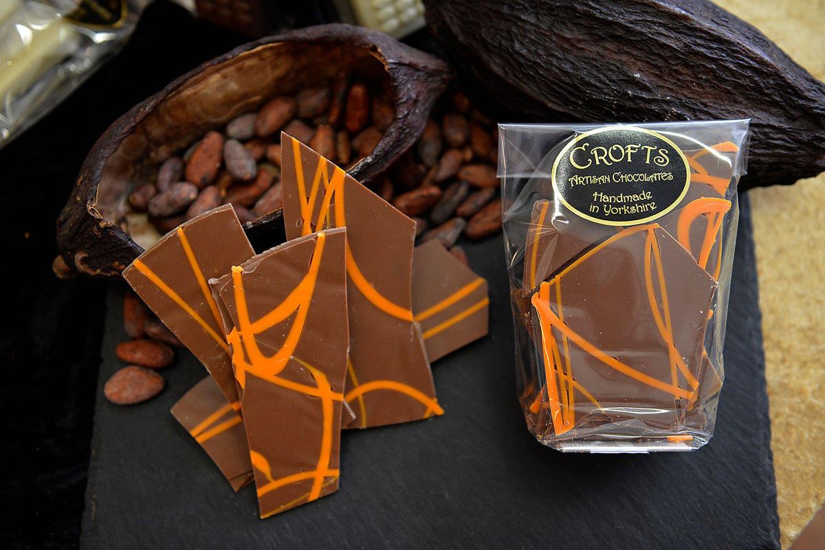 Decorative orange lines enhancing the Orange Chocolate Shards