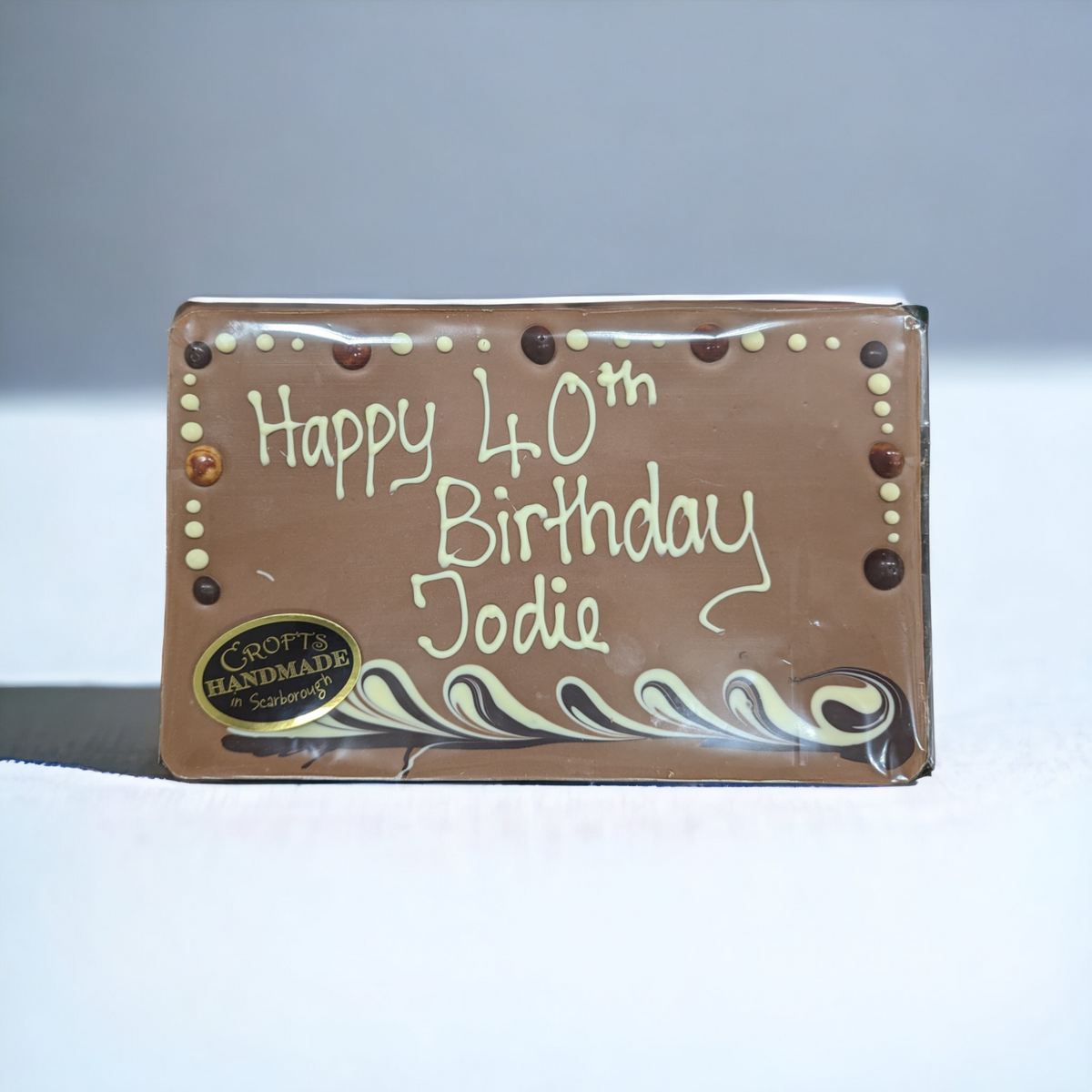 Bespoke Message Chocolate Slab from Crofts Chocolates, showcasing hand-piped white chocolate message