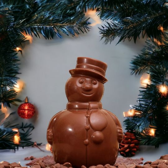 Handmade Belgian chocolate snowman standing 15cm tall, available in milk, dark, and white chocolate by Crofts Chocolates.